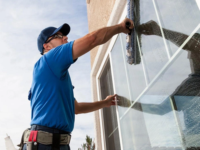 High-Quality Window Washing in Federal Way​ Man cleaning window